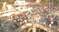 One dead, dozens feared trapped in India building collapse