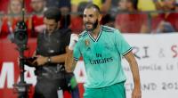 Benzema header beats Sevilla and breathes life back into Real