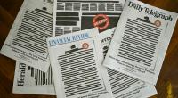 Australian newspapers redact front pages to protest media curbs