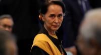 Suu Kyi departs home for genocide hearings amid fanfare
