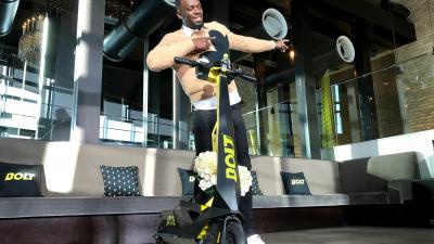 Usain Bolt brings his e-scooter to Japan