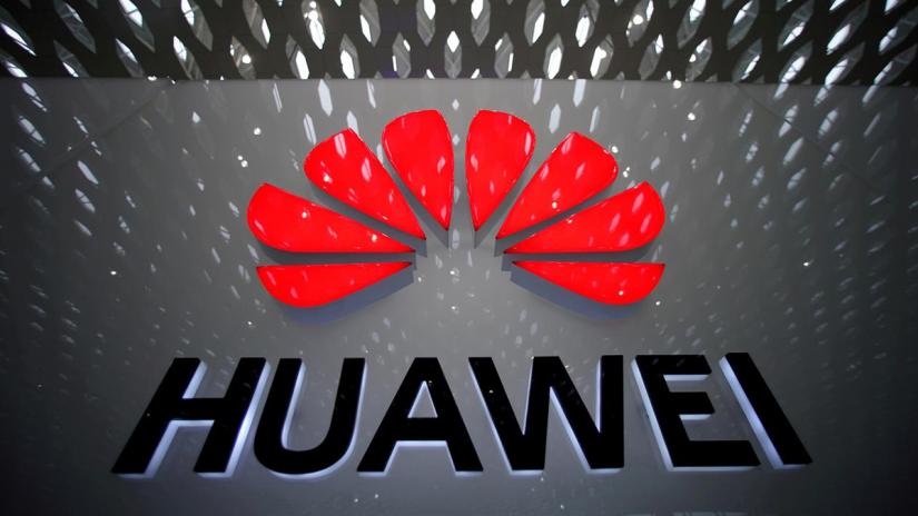 FILE PHOTO: A Huawei company logo is pictured at the Shenzhen International Airport in Shenzhen, Guangdong province, China Jul 22, 2019. REUTERS
